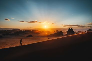 woman-silhouette-at-sunset-on-hill